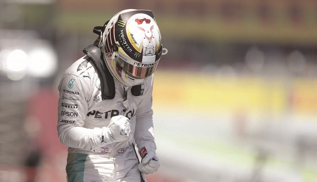 Mercedes AMG Petronas F1 Teamu2019s British driver Lewis Hamilton celebrates in the parc ferme after the qualifying session at the Circuit de Catalunya yesterday.
