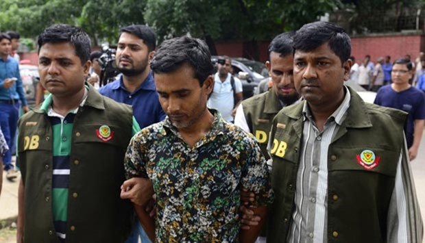 Bangladesh police parade suspect Shariful Islam Shihab in Dhaka on Sunday, after his arrest in connection with the murder of two gay rights activists.