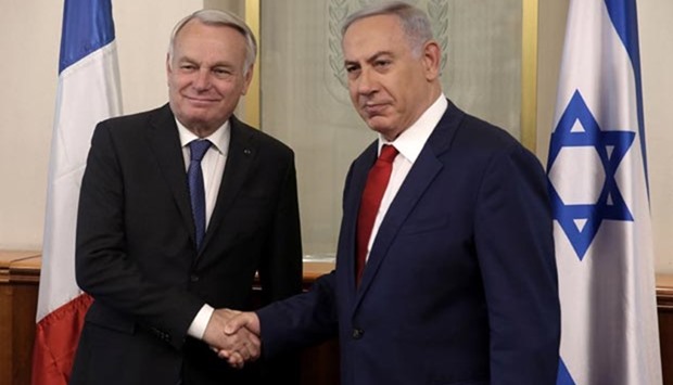 Israeli Prime Minister Benjamin Netanyahu seen with French Foreign Minister Jean-Marc Ayrault during a meeting in Jerusalem on Sunday.