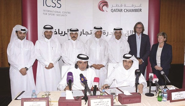 Al-Sharqi, Hanzab with Qatar Chamber and International Centre for Sports Security officials at the agreement signing.