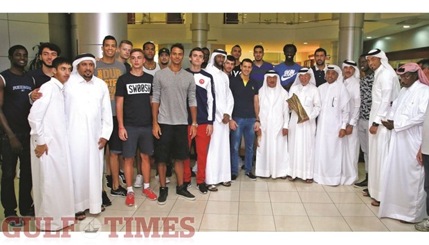 Al Arabi players and officials celebrate their win in the Emir Cup volleyball at a reception hosted at the Al Arabi Sports Club yesterday. The win over El Jaish in the final on Friday gave the club their third straight Emir Cup title and also completed a domestic treble, having already won the Super Cup and the League. PICTURE: Jayaram