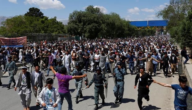 Demonstrators from Hazara minority take part in a protest in Kabul on Monday