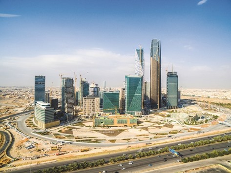 Skyscrapers stand in the King Abdullah financial district in Riyadh. The government will transfer ownership of the King Abdullah Financial District project to the PIF, sources told Reuters.