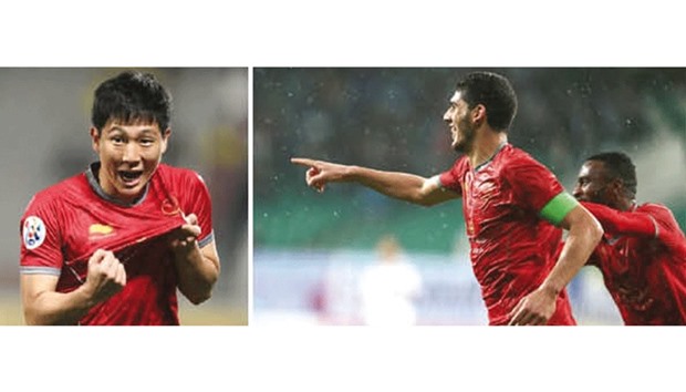 Lekhwiya SC teammates Karim Boudiaf and Nam Tae-hee (left).