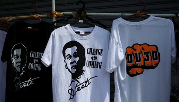 Enterprising vendors display souvenir shirts of president-elect Rodrigo ,Digong, Duterte along a sidewalk in Davao city.