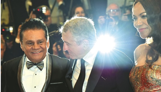 Panamanian boxer Roberto Duran, De Niro and his wife Grace Hightower, arrive on Monday night for the screening of the film Hands of Stone.