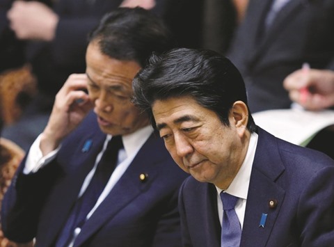 Japanu2019s Prime Minister Shinzo Abe (right) and Deputy Prime Minister and Finance Minister Taro Aso attend a lower house budget committee session at the parliament in Tokyo. Japan has failed to bridge differences with the US on the yen, with Washington dismissing Tokyou2019s concerns that recent yen rises are excessive and instead pushing for agreements against currency market interventions.