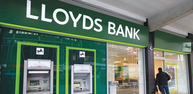 A man enters a Lloyds Bank branch in central London. Regulators and lawmakers are keen to increase competition in a sector dominated by the four lenders u2014 Lloyds Banking Group, Royal Bank of Scotland, Barclays and HSBC u2014 which control more than three-quarters of current accounts and provide nine out of 10 business loans.