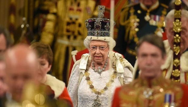 Queen Elizabeth proceeds through the Royal Gallery during the opening of parliament in London on Wednesday.