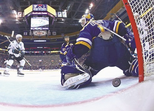 Brian Elliott of the St. Louis Blues fails to save a shot from Brent Burns (left) of the San Jose Sharks during the second period in Game Two of the Western Conference Final of the 2016 NHL Stanley Cup Playoffs in St Louis, Missouri. (AFP)