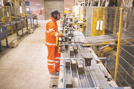 An employee inspects bricks at the Forterra Building Products brickworks near Peterborough, UK. The number of people in work rose by 44,000, less than a quarter of the gain seen at the end of 2015, the Office for National Statistics in London said yesterday.