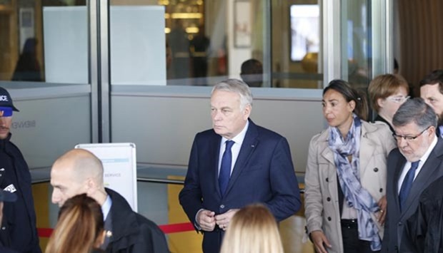French Foreign minister Jean-Marc Ayrault (centre) leaves a hotel where relatives of passengers of missing MS804 Egyptair flight are gathered next to Roissy-Charles De Gaulle airport in Paris on Thursday.