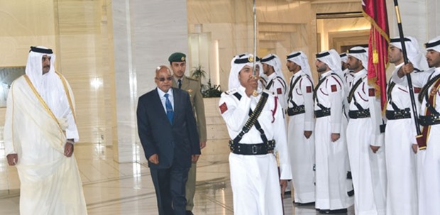 South African President Jacob Zuma, accompanied by HH the Emir Sheikh Tamim bin Hamad al-Thani, reviewing a guard of honour at the Emiri Diwan yesterday.