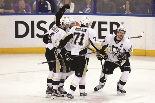 Pittsburgh Penguins players celebrate a goal against Tampa Bay Lightning during Game 3 of the 2016 NHL Stanley Cup Playoffs in Tampa, Florida, on Wednesday. (AFP)