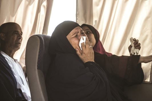 A relative of a passenger who was flying aboard the crashed EgyptAir plane cries.