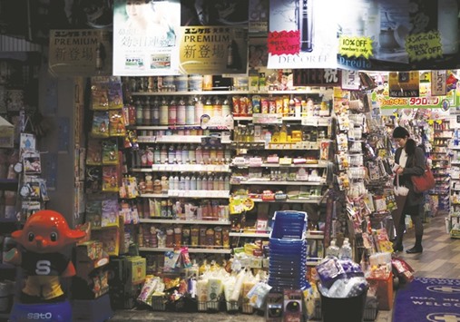 A shopper at a discount drug store in Tokyo. The Japanese government plans to raise the sales tax to 10% from 8% next spring unless there is a financial crisis on the scale of the Lehman Brothers collapse or a major natural disaster.