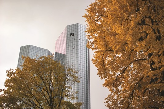 The Deutsche Bank headquarters are seen in Frankfurt. Deutsche Bank is reviewing a 2009 deal that sought to profit from differences in prices of credit indexes and the underlying debts that compose them, according to a person with knowledge of the situation. Six employees participated with personal investments alongside a hedge fund, the person said.