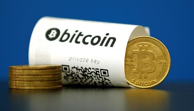 A bitcoin (virtual currency) paper wallet with QR codes and a coin are seen in an illustration
