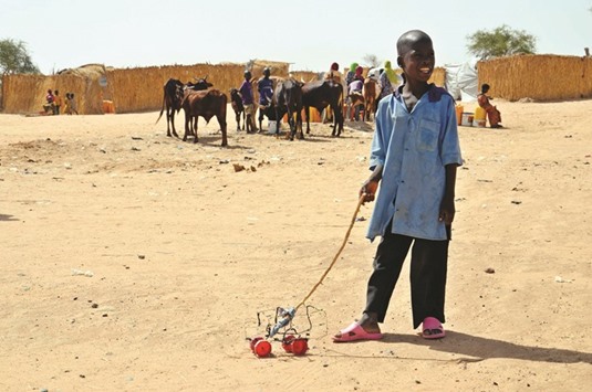 A child walks inside the Assaga refugee camp near Diffa in southeast Niger.