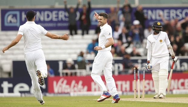 England fast bowler James Anderson celebrates after dismissing Sri Lankau2019s last wicket Nuwan Pradeep (right) during the first Test at Headingley, Leeds yesterday. (Reuters)