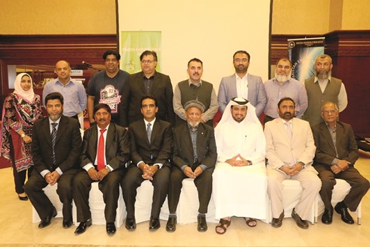 SHEDDING LIGHT: Members of PEF Qatar with the chief guest and guest speakers at the seminar on autism and the use of technology.