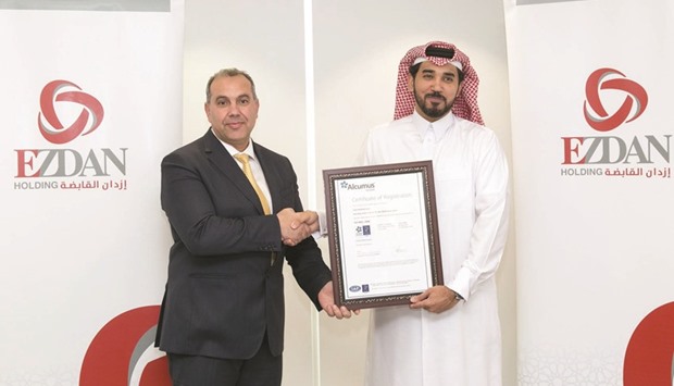 Ezdan Holding Group chief operating officer Dr Mousa al-Awwad receiving the ISO certification.