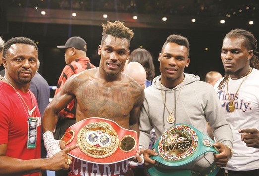 Twin brothers IBF junior middleweight champion Jermall Charlo (L) and WBC super welterweight champion Jermell Charlo display their belts at The Chelsea at The Cosmopolitan of Las Vegas. (Getty Images/AFP)