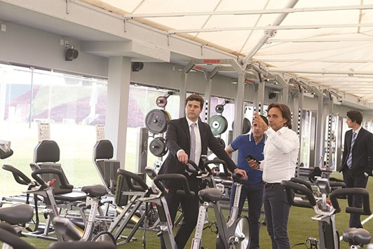 Tottenham Hotspur manager Mauricio Pochettino (left) interacts with Aspire Academy officials during his visit.