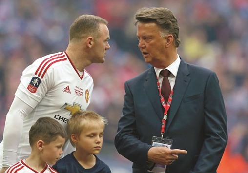 Manchester United striker Wayne Rooney (left) with the clubu2019s Dutch manager Louis van Gaal. during Saturday's FA Cup final against Crystal Palace. (AFP)