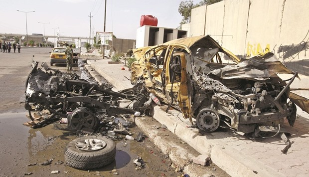 The remains of the car that exploded in the Saydiya district of southern Baghdad yesterday.