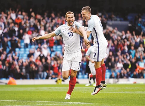 England striker Harry Kane (left) celebrates with team-mate Jamie Vardy after scoring a goal against Turkey during the International Friendly at Etihad Stadium in Manchester on Sunday. (Reuters)