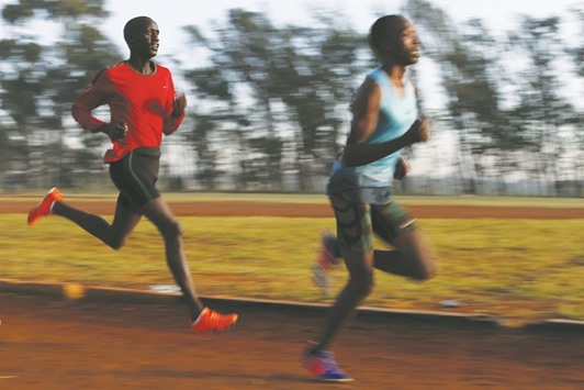 Athletes exercise in the early morning in the sports ground of the University of Eldoret in western Kenya.