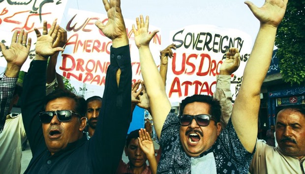 Pakistani civil society activists shout slogans during a demonstration in Multan yesterday against a US drone strike in Pakistanu2019s southwestern province of Balochistan.