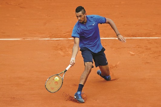 Nick Kyrgios in action against Italyu2019s Marco Cecchinato in the first round of the French Open in Paris on Sunday. (Reuters)