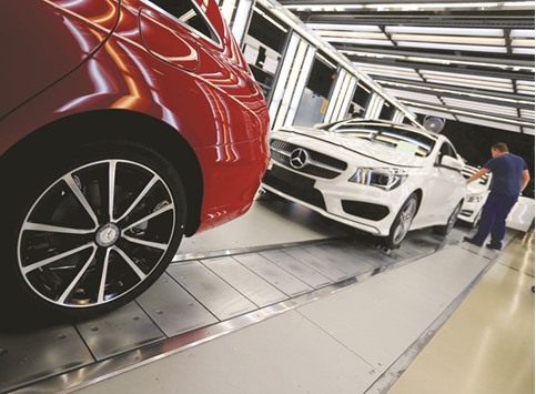 Factory workers inspect cars on the assembly line at Daimleru2019s Mercedes factory in Kecskemet, Hungary.  Offering the latest evidence that a strong acceleration in eurozoneu2019s growth in the first three months of the year was only temporary, Markitu2019s flash Composite Purchasing Managersu2019 Index edged down to 52.9 from Aprilu2019s 53.0.