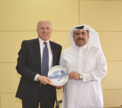 Dr Ali Hamed al-Mulla, assistant secretary-general for Industrial Projects Sector, receiving a token from John Pace, ASTM vice-president of Publications & Marketing.