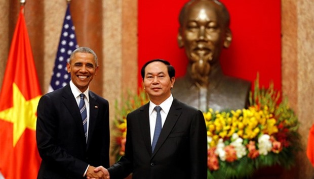 US President Barack Obama shakes hands with Vietnam's President Tran Dai Quang
