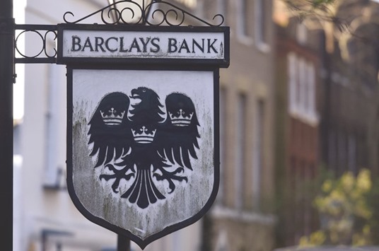 A Barclays sign is seen outside a branch of the bank in London. Shares in Barclays climbed 3.2% yesterday.