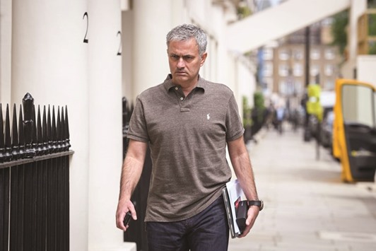 Portuguese football manager Jose Mourinho is pictured as he returns to his home in London yesterday.