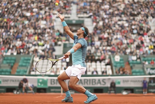 Rafael Nadal of Spain serves during his first round French Open match against Australiau2019s Sam Groth in Paris yesterday. (Reuters)