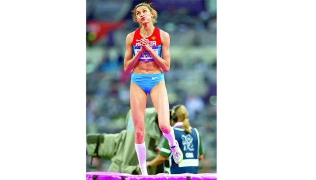 Anna Chicherova of Russia reacts after clearing the high jump bar during the womenu2019s high jump final at Olympic Stadium during the 2012 Summer Olympic Games in London. (Kansas City Star)