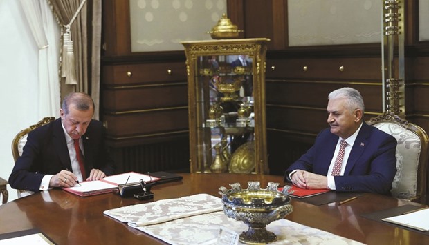 Yildirim with Erdogan at the Presidential Palace after the prime minister submitted his new cabinet line-up, two days after being given a mandate.