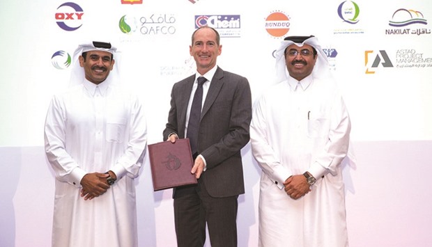HE Dr Mohamed bin Saleh al-Sada and Qatar Petroleum president & CEO Saad Sherida al-Kaabi with Alistair Routledge.