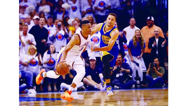 Russell Westbrook (left) of Oklahoma City Thunder drives against Stephen Curry of the Golden State Warriors during Game 4 of Western Conference Finals in Oklahoma City on Tuesday night. (AFP)