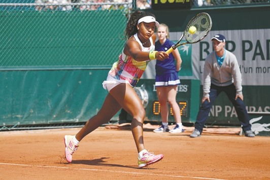 Naomi Osaka returns the ball during her French Open second round match against Mirjana Lucic-Baroni of Croatia at Roland Garros in Paris, France yesterday. (Reuters)