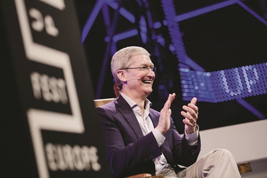 Tim Cook, chief executive officer of Apple, applauds during a conference in Amsterdam on Tuesday. u201cIf you drive for a while and your car gets too hot, it says pull over. If you need an oil change, it says check your oil. Whatu2019s the equivalent for the body?u201d Cook asks.