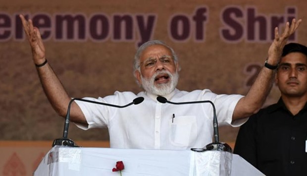 Narendra Modi gestures as he addresses a rally in the north-eastern state of Assam earlier this week. Modi's government has completed two years in power.
