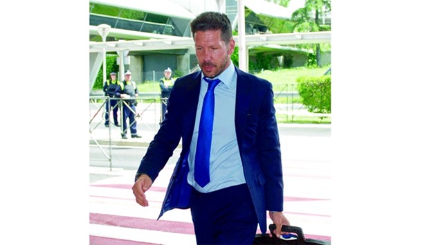 Atletico Madridu2019s coach Diego Simeone at Madrid airport yesterday.  (AFP)