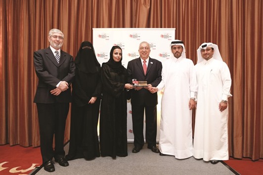The Qatar Foundation team with the award.