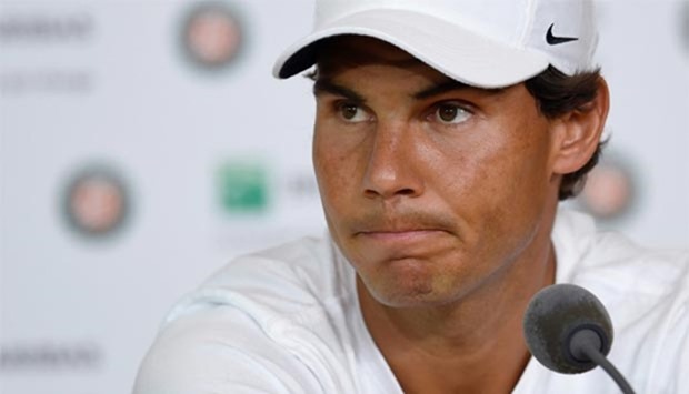 Rafael Nadal addresses a press conference to annonce his withdrawal from the French Open at the Roland Garros in Paris on Friday.